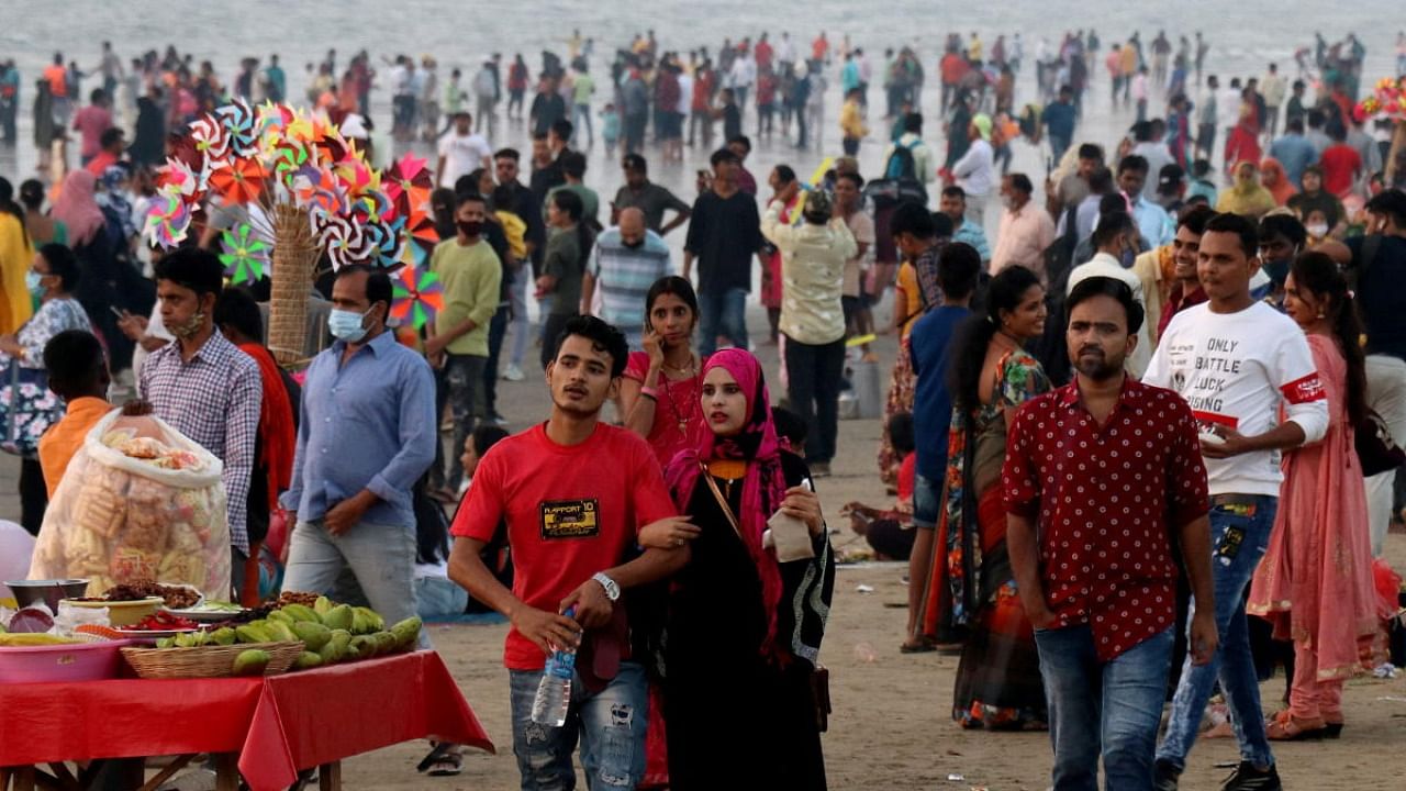 People visit Juhu beach during the ongoing coronavirus pandemic, in Mumbai. Credit: Reuters Photo