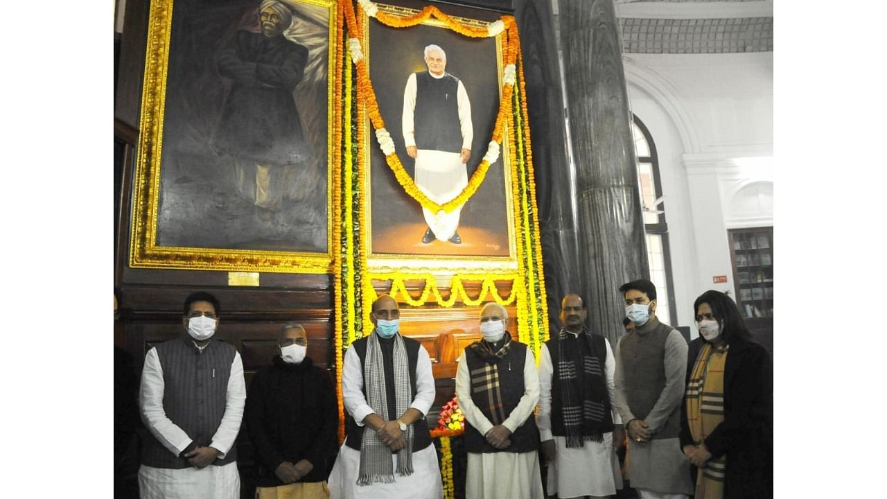 Lok Sabha Speaker Om Birla looks on as Prime Minister Narendra Modi with other Union Ministers after paying tribute to former Prime Minister Atal Bihari Vajpayee on his Birth Anniversary at the Central of the Parliament in New Delhi on Saturday. Credit: IANS Photo