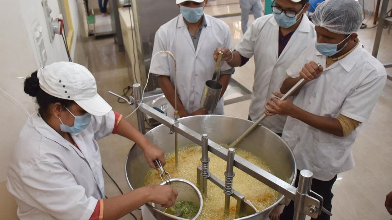 Students make dairy products at the Dairy Science College at Hebbal in Bengaluru on Friday. Credit: DH Photo/ BK Janardhan