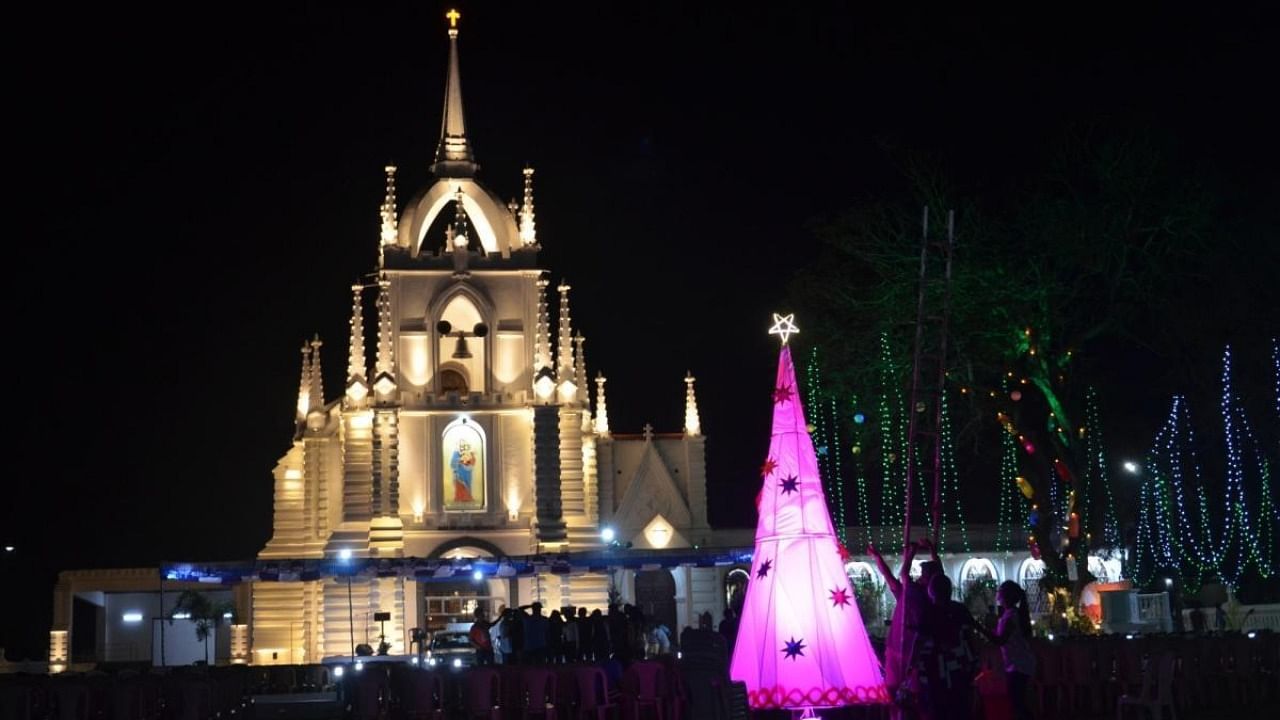 An Illuminated Church on the eve of Christmas, while several churches and streets are beautifully decorated with lights at Saligao in North Goa on Friday December 24,2021. Credit: IANS Photo