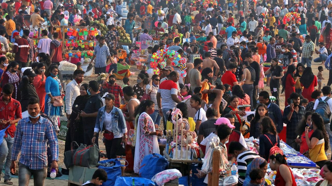 People visit Juhu beach during the ongoing coronavirus disease (Covid-19) pandemic, in Mumbai. Credit: Reuters Photo