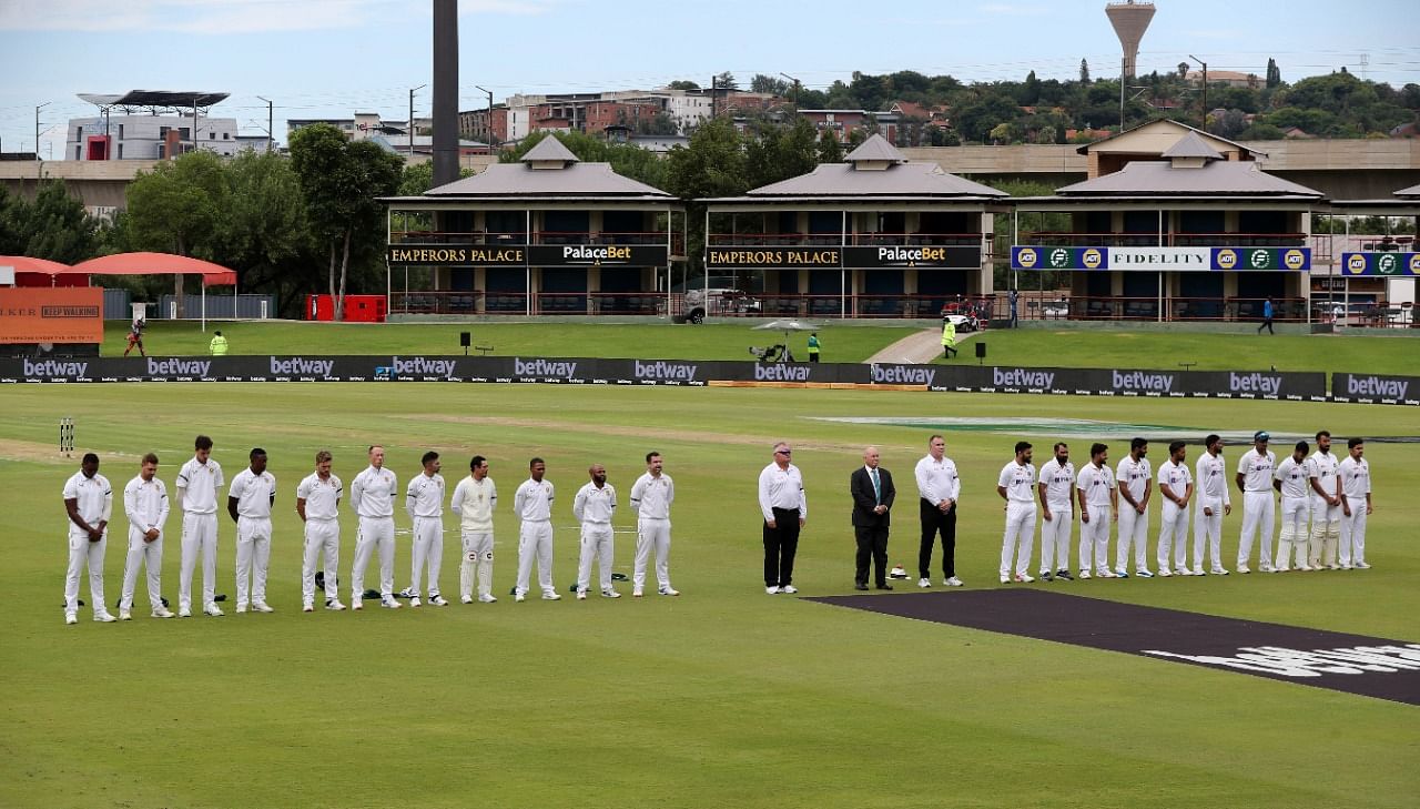 Players and officials during a moment of silence for the passing of Archbishop Desmond Tutu. Credit: Reuters Photo