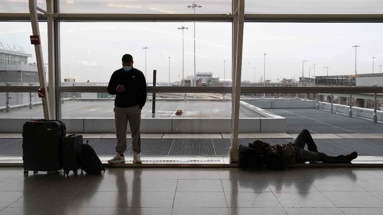 People wait at departure floor of John F. Kennedy International Airport in New York. Credit: AFP Photo