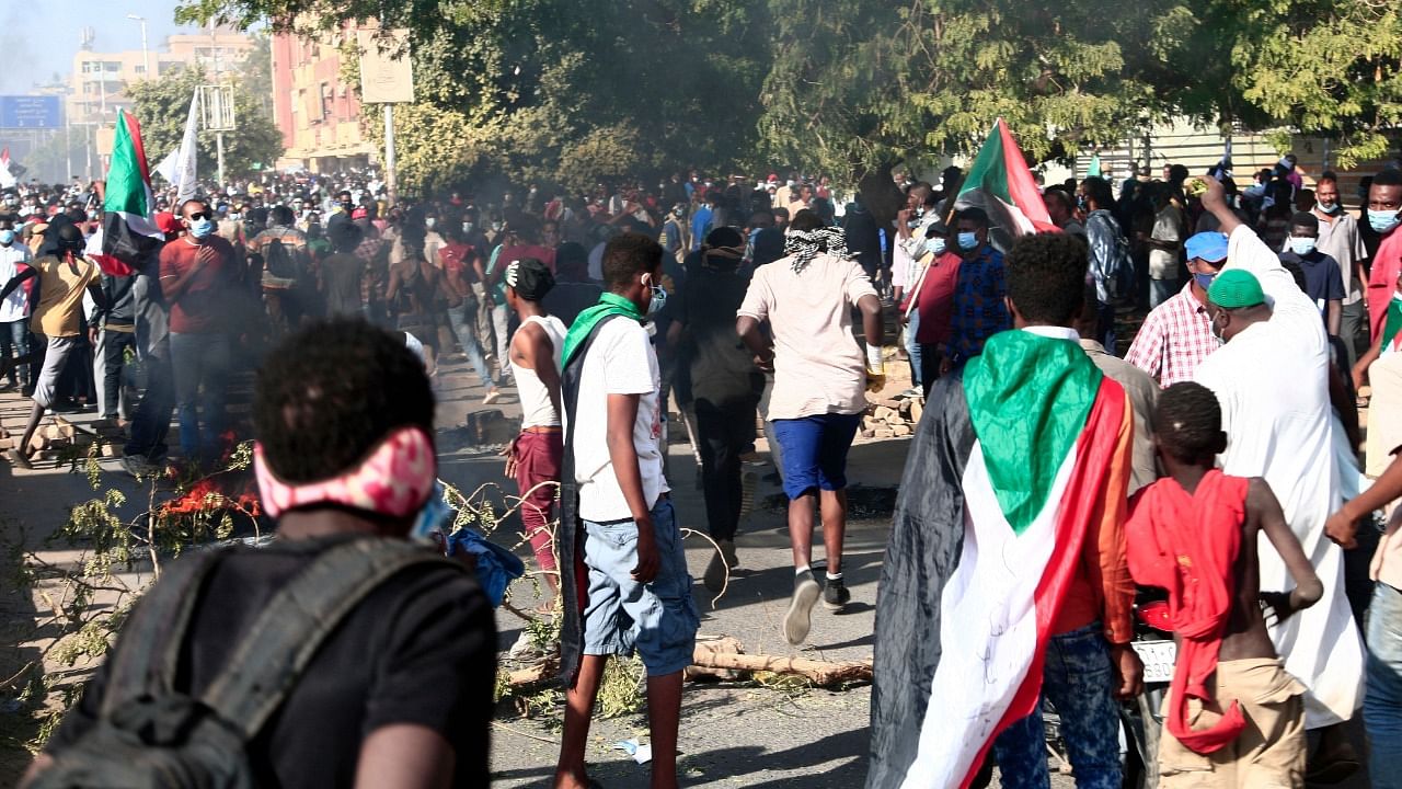 Sudanese demonstrators take to the streets in the capital Khartoum. Credit: AFP Photo