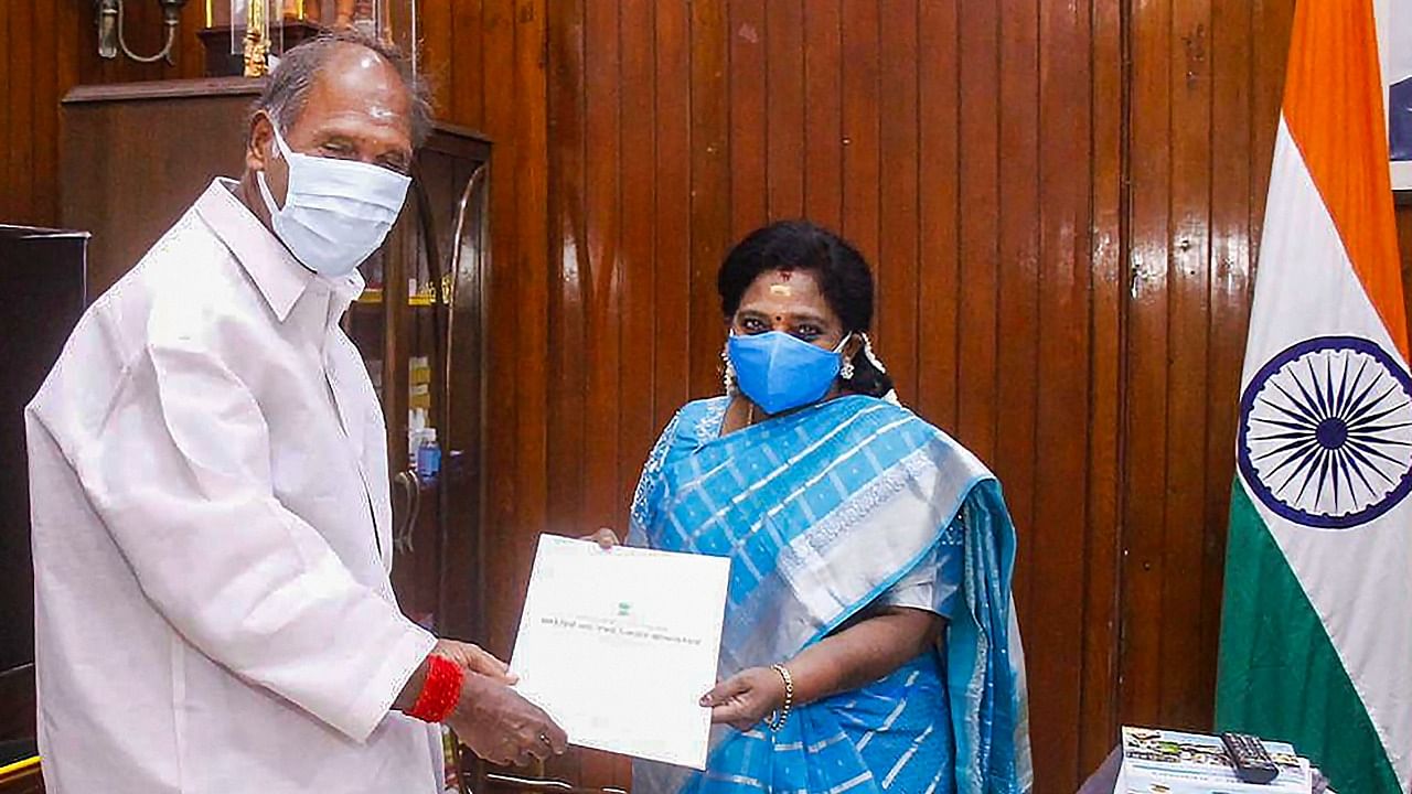 Chief Minister N Rangasamy hands over a list recommending allocation of portfolios to five ministers newly inducted in his cabinet to Lt Governor Tamilisai Soundararajan, in Puducherry. Credit: PTI File Photo