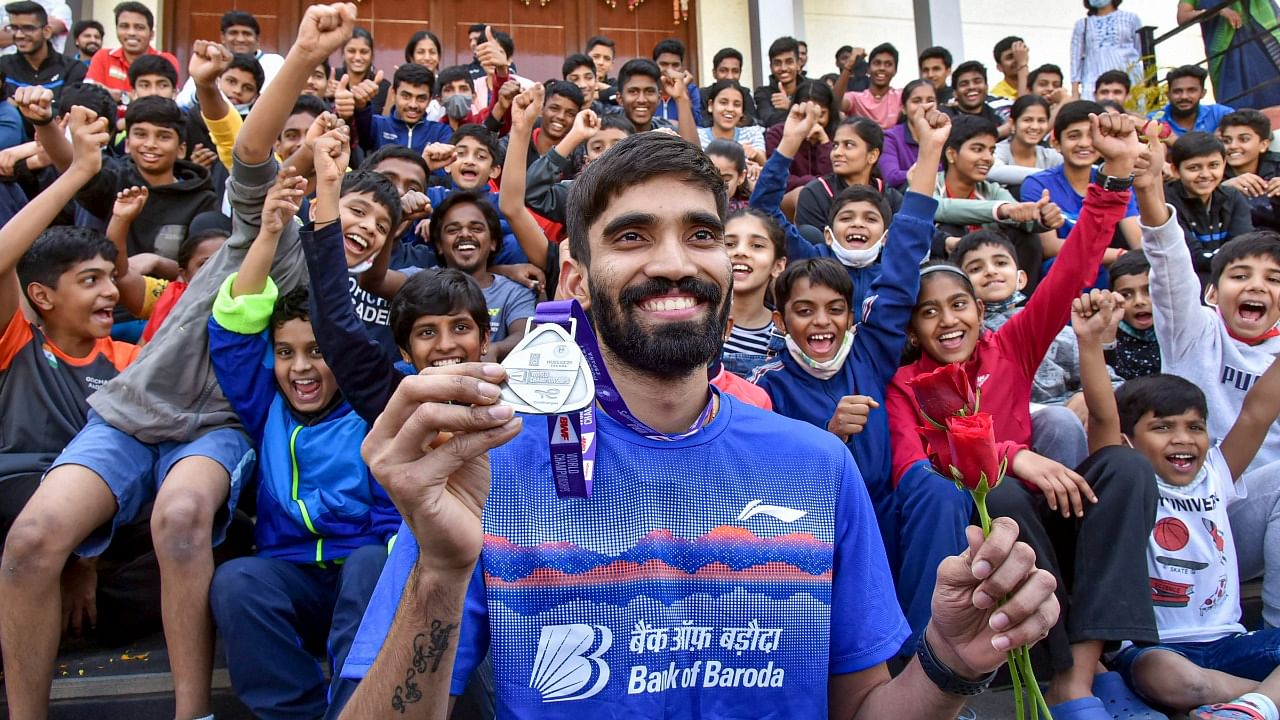Kidambi Srikanth displays his silver medal from the World Championships in Spain this year. Credit: PTI Photo