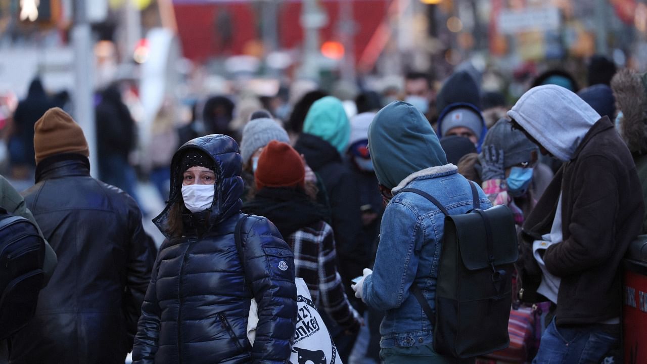 People queue for a Covid-19 test in Times Square as the Omicron coronavirus variant continues to spread in Manhattan, New York. Credit: Reuters Photo