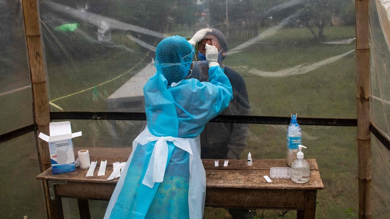 A handful of Myanmar nurses hiding from the junta run makeshift clinics to treat Covid patients and resistance fighters using medicine smuggled past military checkpoints, their bags packed and ready to flee as fighting rages around them. Credit: AFP File Photo