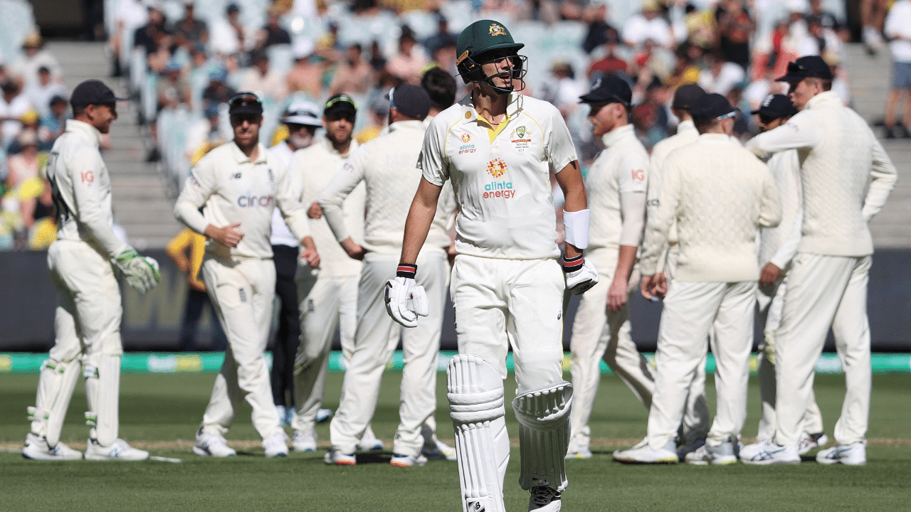 Australia's Pat Cummins walks of the pitch after losing his wicket during day 2 of the Third Test. Credit: Reuters Photo