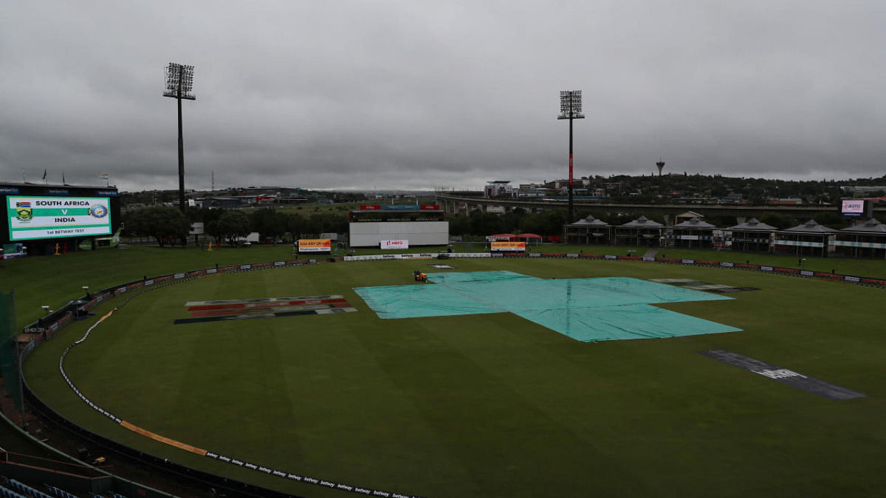 General view of the SuperSport Park Cricket Stadium pitch covered as the South Africa vs India match is delayed due to rain. Credit: Reuters photo