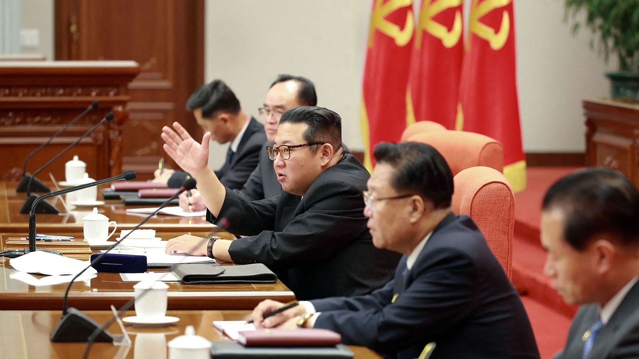 Kim Jong Un (C) attends the 4th Plenary Meeting of the 8th Central Committee of the Workers' Party of Korea. Credit: AFP Photo/KCNA via KNS