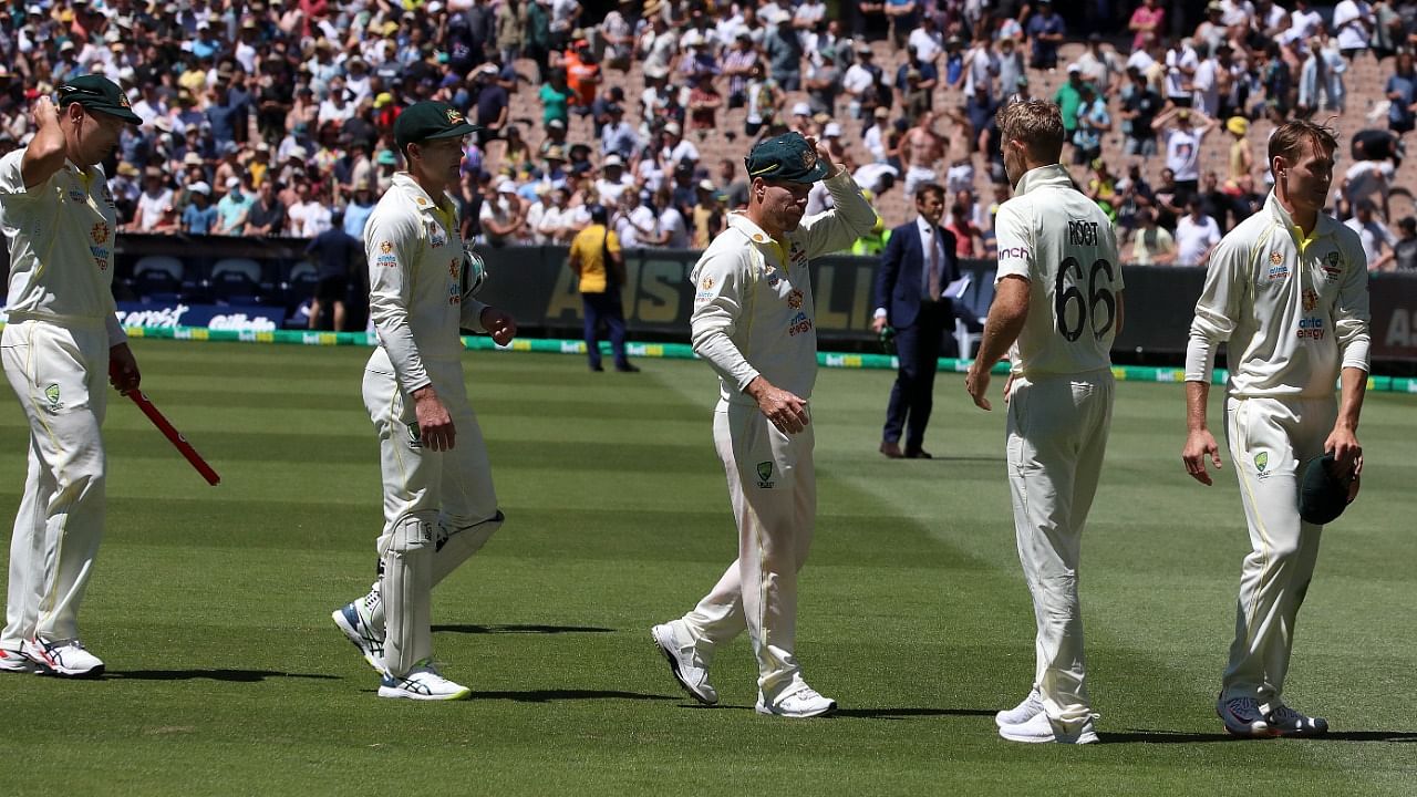 England's Joe Root, second right, shakes hands with Australian players on the third day of their cricket test match in Melbourne, Australia, Tuesday, December 28, 2021. Credit: AP/PTI File Photo