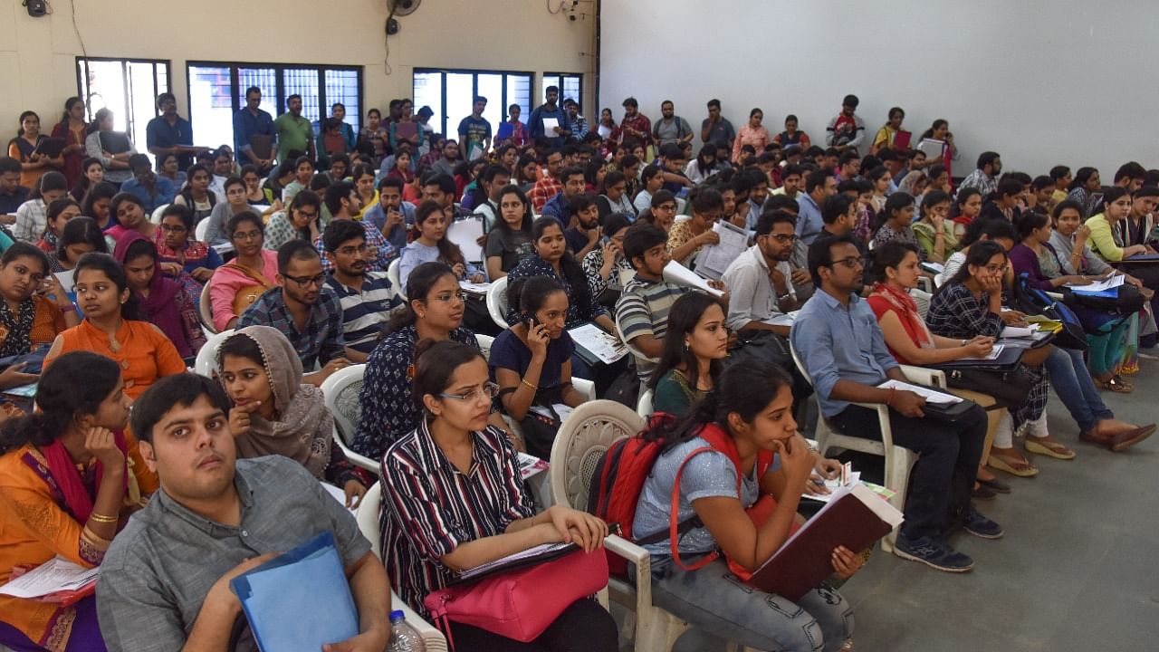 A file photo of students waiting for counselling at the Karnataka Examination Authorityssociation office in Bengaluru. Credit: DH Photo