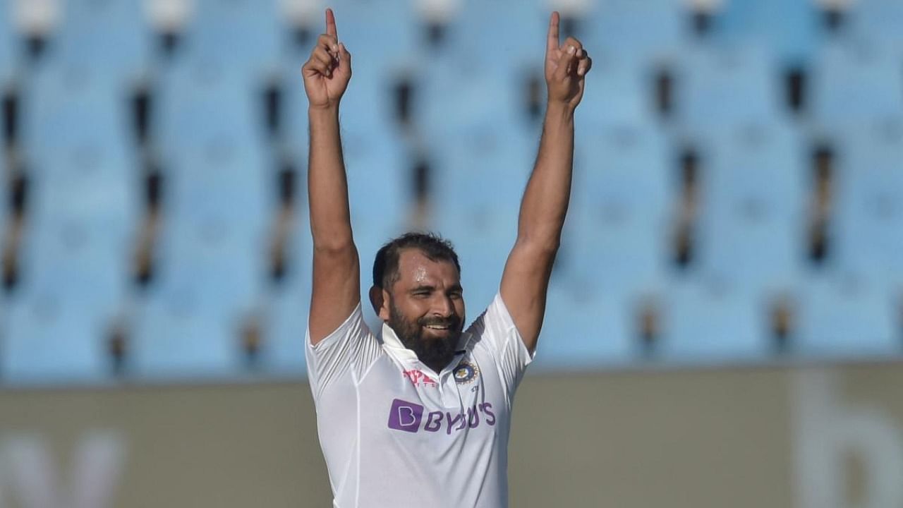 Mohammed Shami celebrates after the dismissal of South Africa's Kagiso Rabada (not seen) during the third day of the first Test cricket match between South Africa and India. Credit: AFP Photo