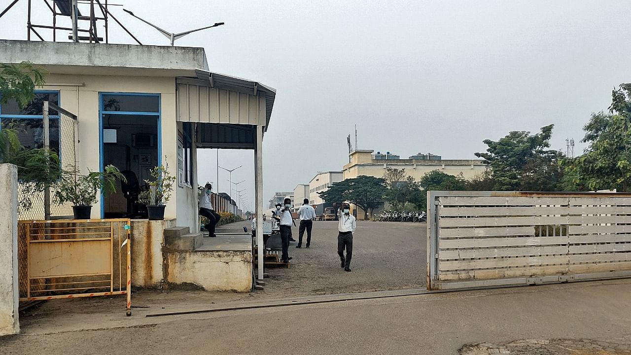 Private security guards stand at the entrance of a closed plant of Foxconn India unit, which makes iPhones for Apple Inc, near Chennai, India. Credit: Reuters Photo