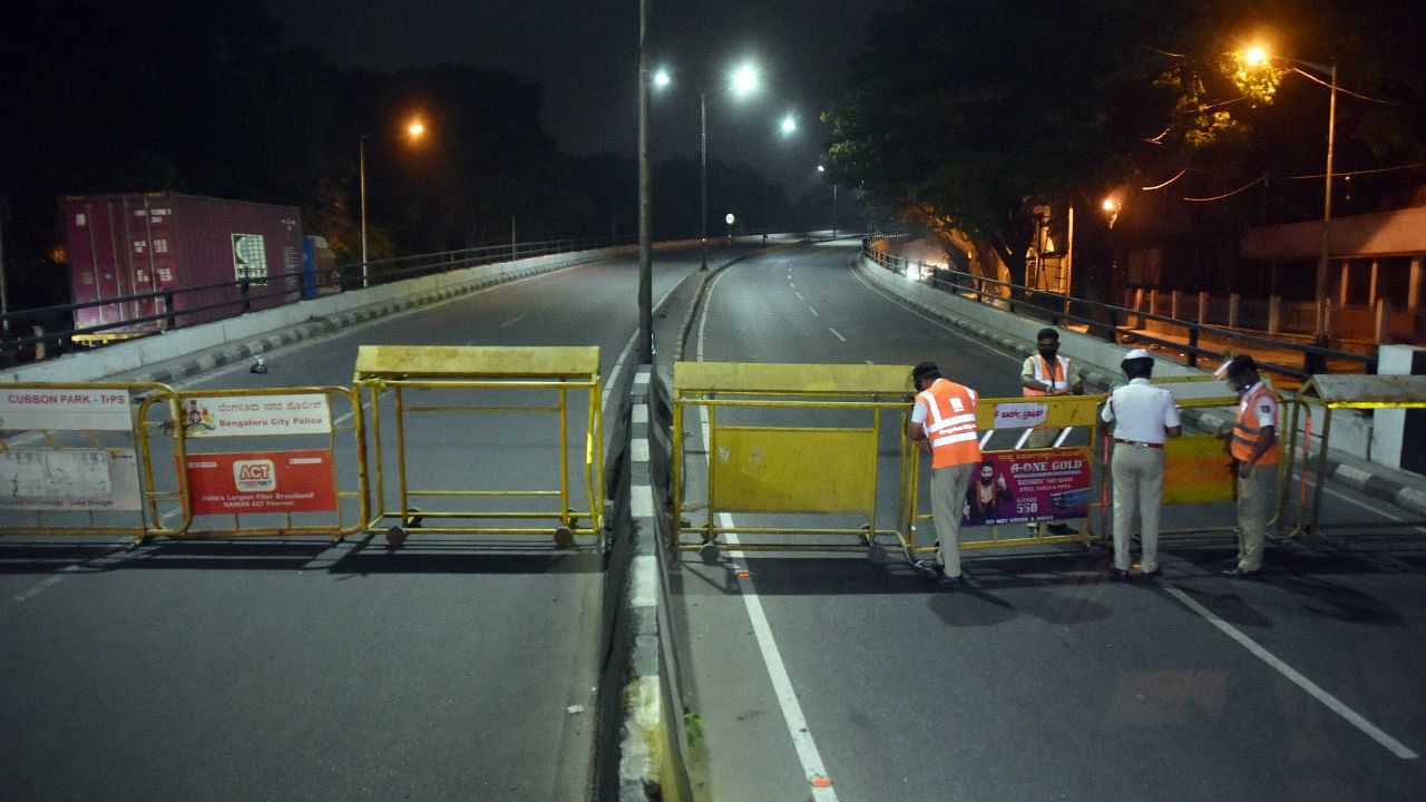 Frontline users and workers belonging to exempted categories have to use alternative roads for commuting during the night. Credit: DH File Photo