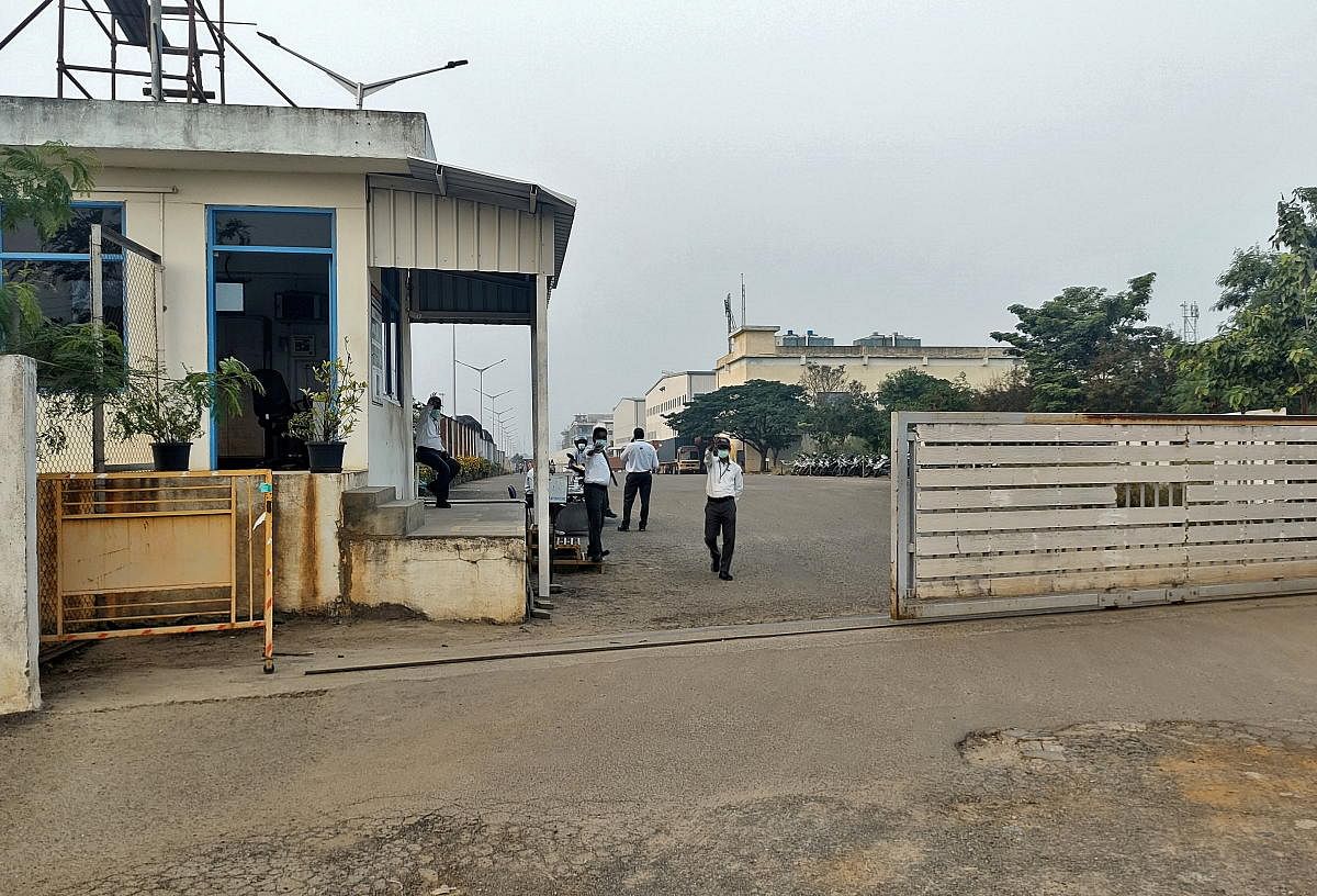 Private security guards stand at the entrance of a closed plant of Foxconn India unit, near Chennai. Credit: Reuters File Photo