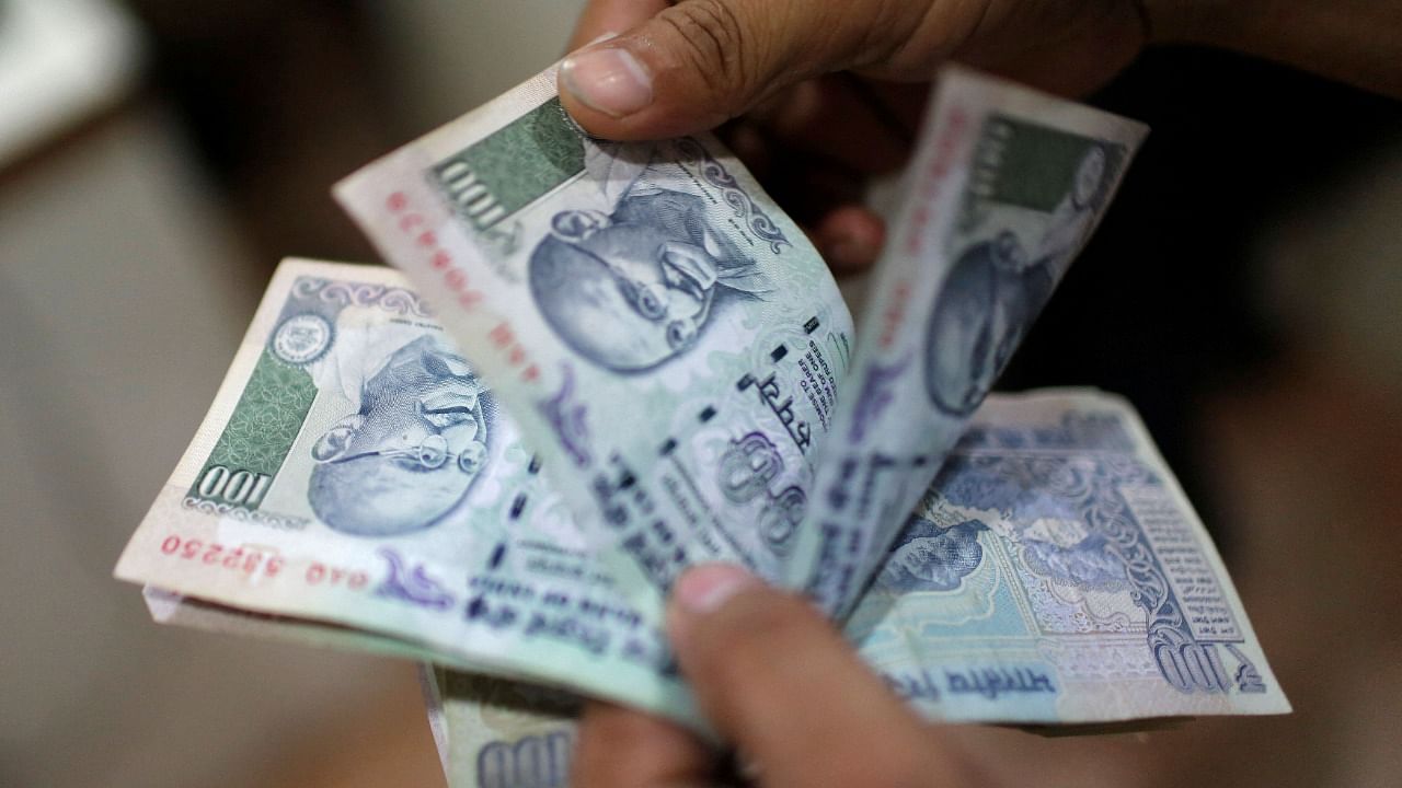 The rupee on Wednesday settled just one paisa lower at 74.71 against the US dollar. Credit: Reuters Photo