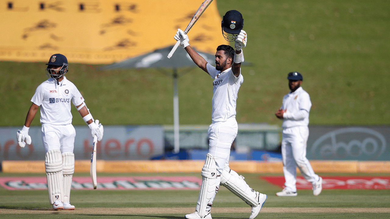 India's KL Rahul (C) celebrates after scoring a century (100 runs) during the first day of the first Test cricket match between South Africa and India. Credit: AFPP Photo