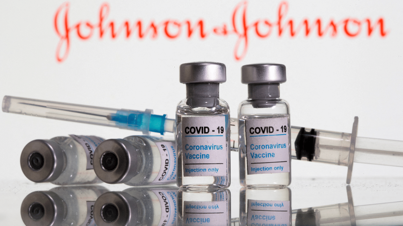 Vials labeled 'Covid-19 Coronavirus Vaccine' and syringe are seen in front of displayed Johnson & Johnson. Credit: Reuters Photo