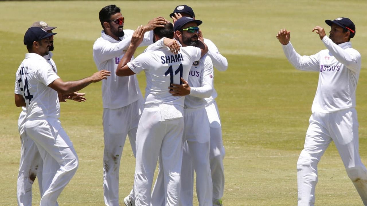 India's Mohammed Shami celebrates with teammates after taking the wicket of South Africa's Wiaan Mulder. Credit: Reuters Photo