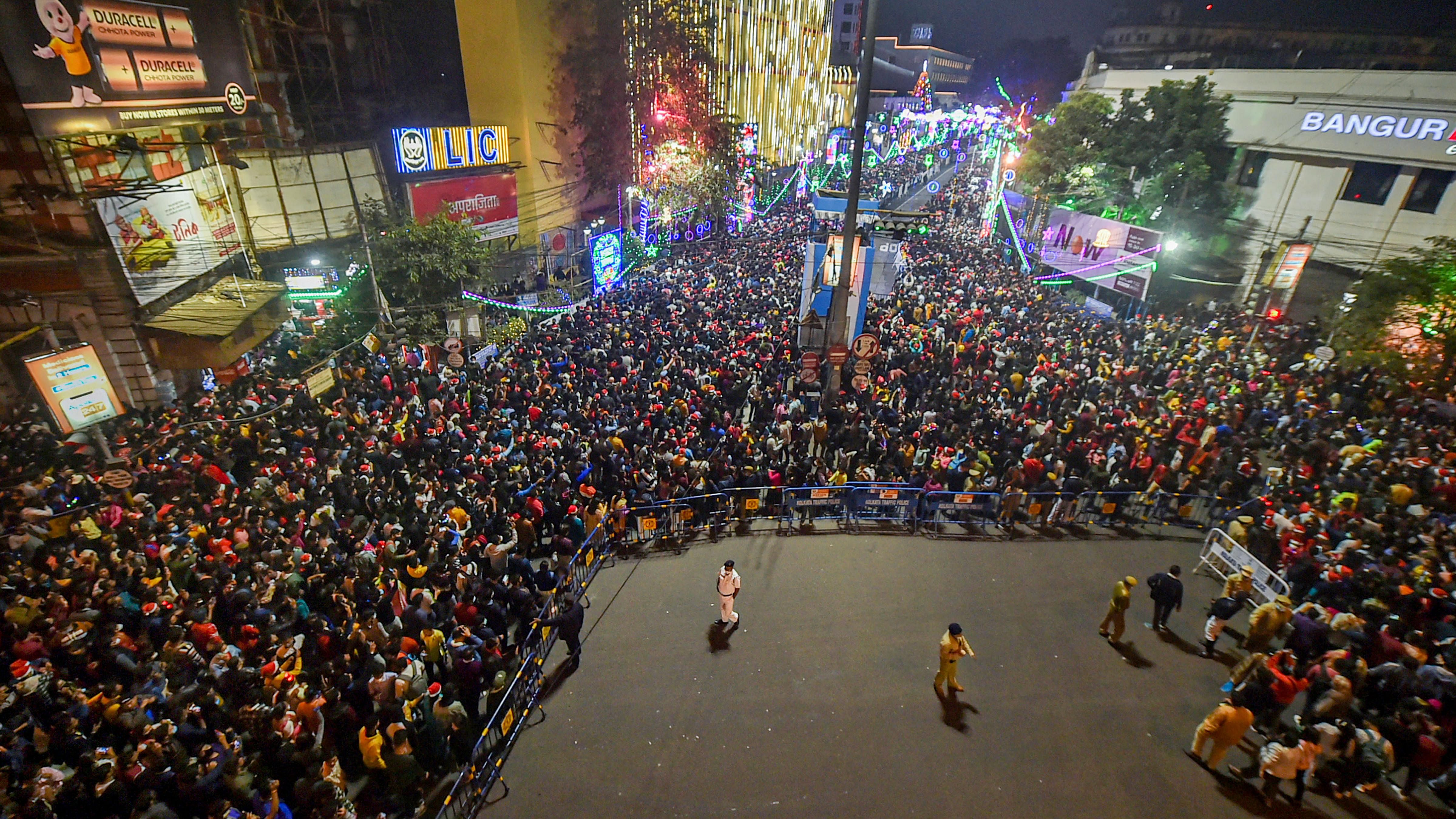 People gather at Park Street to celebrate Christmas day in Kolkata. Credit: PTI File Photo