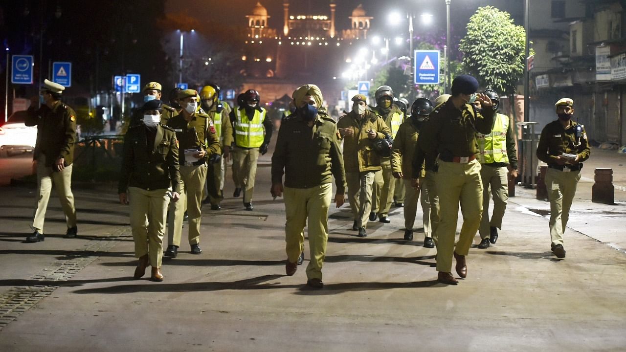 Policemen patrol during the night curfew between 11 pm to 5 am imposed by the Delhi government to curb the spread of Covid-19. Credit: PTI Photo