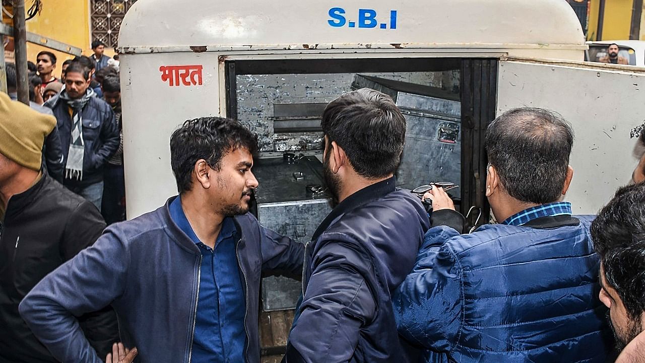 Directorate General of Goods and Services Tax Intelligence (DGGI) team recover gold and cash after raiding a residence of businessman Peeyush Jain, in Kannauj. Credit: PTI Photo