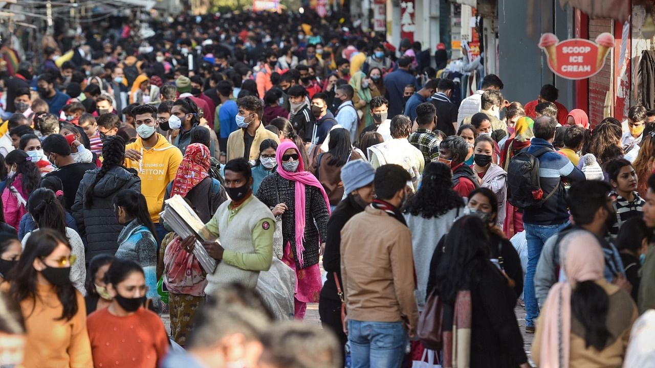 People visit a crowded Sarojini Nagar Market, open on odd-even system as per guidelines set by the Delhi government, in New Delhi. Credit: PTI Photo