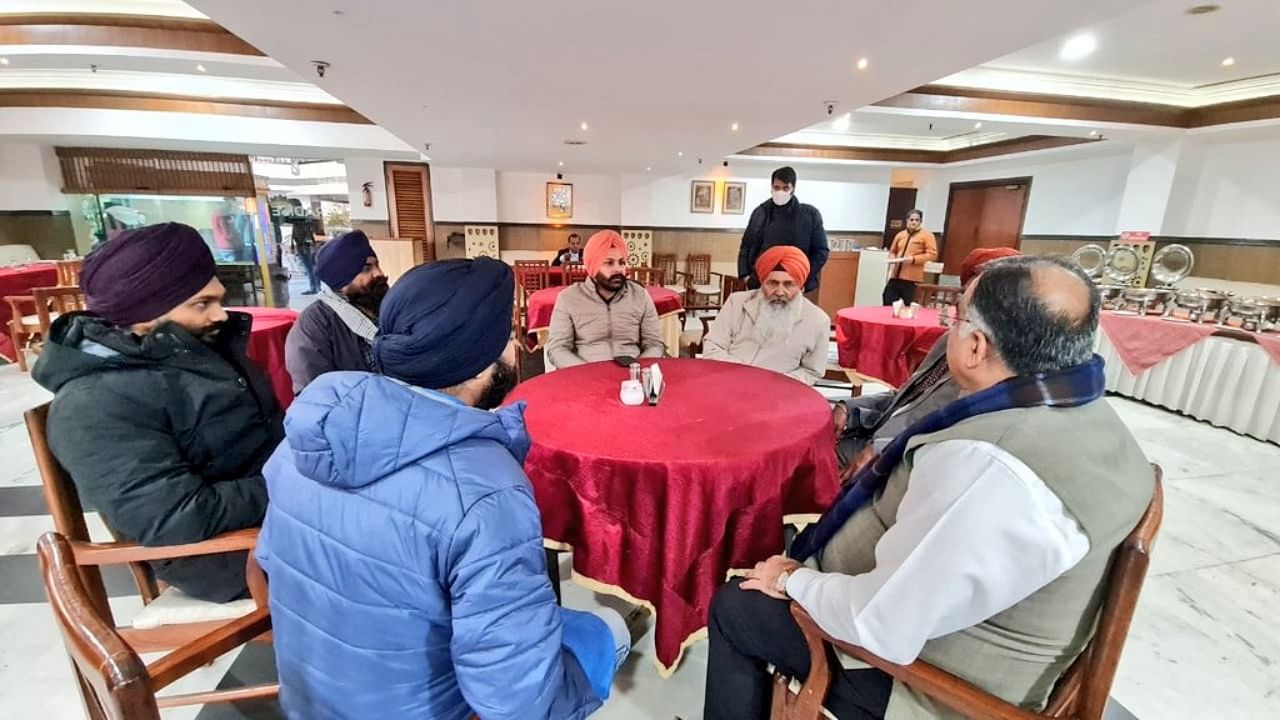 Chief Minister Pushkar Singh Dhami and BJP national General Secretary Tarun Chugh met a delegation of influential Sikh leaders from the state on Friday and highlighted the works carried out by the Narendra Modi-led government for them. Credit: Twitter/ @tarunchughbjp