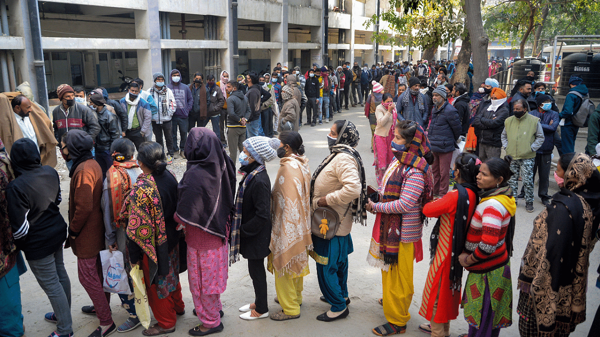 Beneficiaries wait in queues to receive Covid-19 vaccine dose, at a vaccination centre of Civil hospital. Credit: PTI Photo