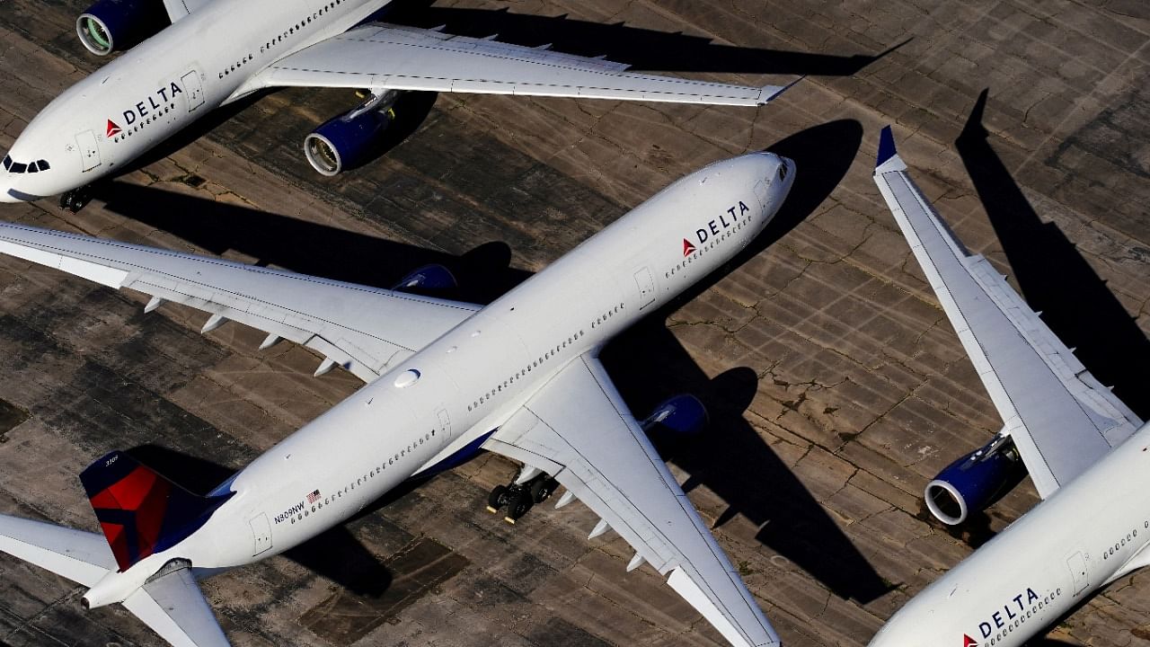 Delta Air Lines passenger planes are seen parked due to flight reductions made to slow the spread of Covid-19, at Birmingham-Shuttlesworth International Airport in Birmingham, US. Credit: Reuters File Photo