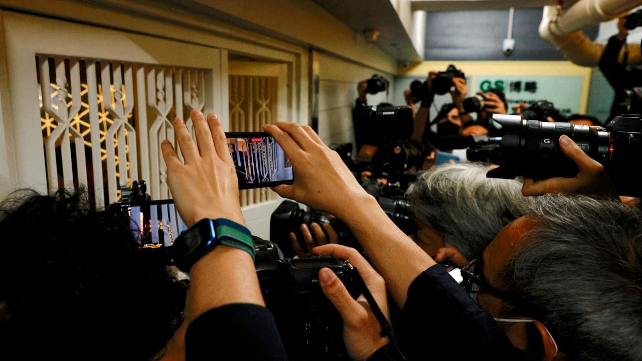 Members of the media are seen outside the Stand News office, after six people were arrested "for conspiracy to publish seditious publication" according to Hong Kong's Police National Security Department, in Hong Kong. Credit: Reuters Photo