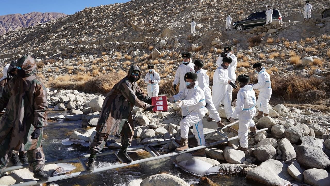 Indian and Chinese soldiers exchange sweets at Hot Springs Demchok on LAC in eastern Ladakh. Credit: Indian Army