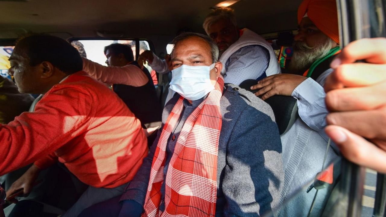 BJP Delhi President Adesh Gupta being detained for staging a traffic blockade during a protest against AAP government’s new excise policy, in New Delhi. Credit: PTI Photo