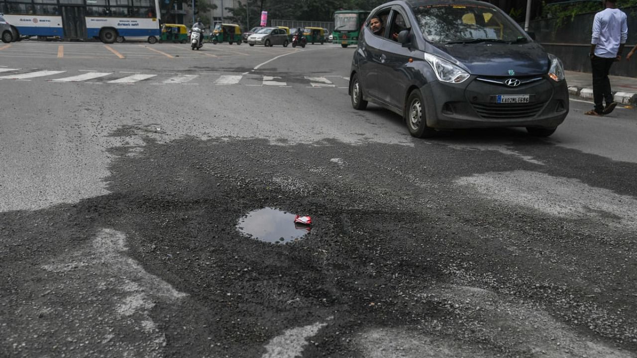 A pothole is seen at KR Circle, in Bengaluru. Credit: DH Photo