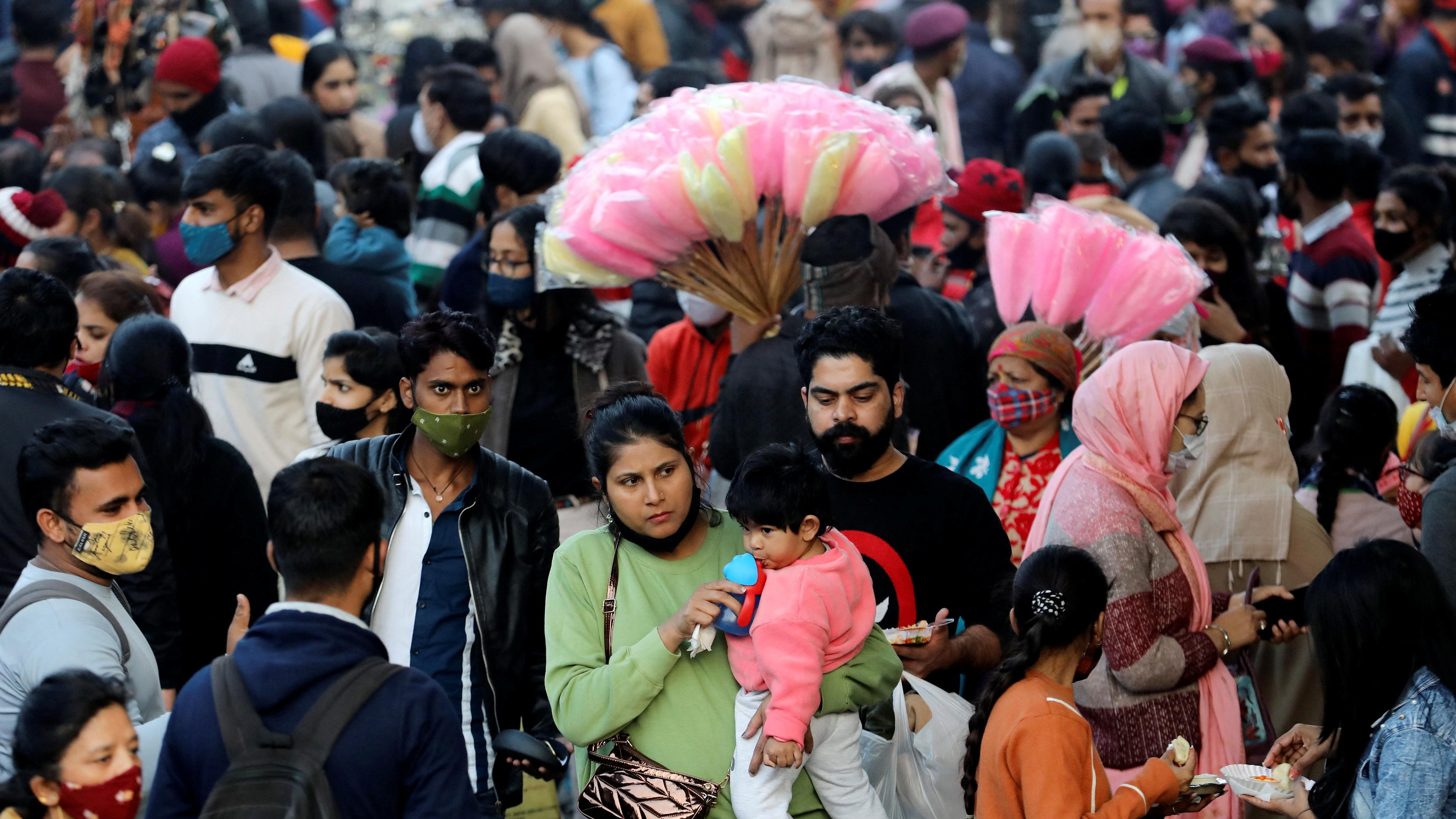 People shop at a crowded market in Delhi. Credit: Reuters File Photo