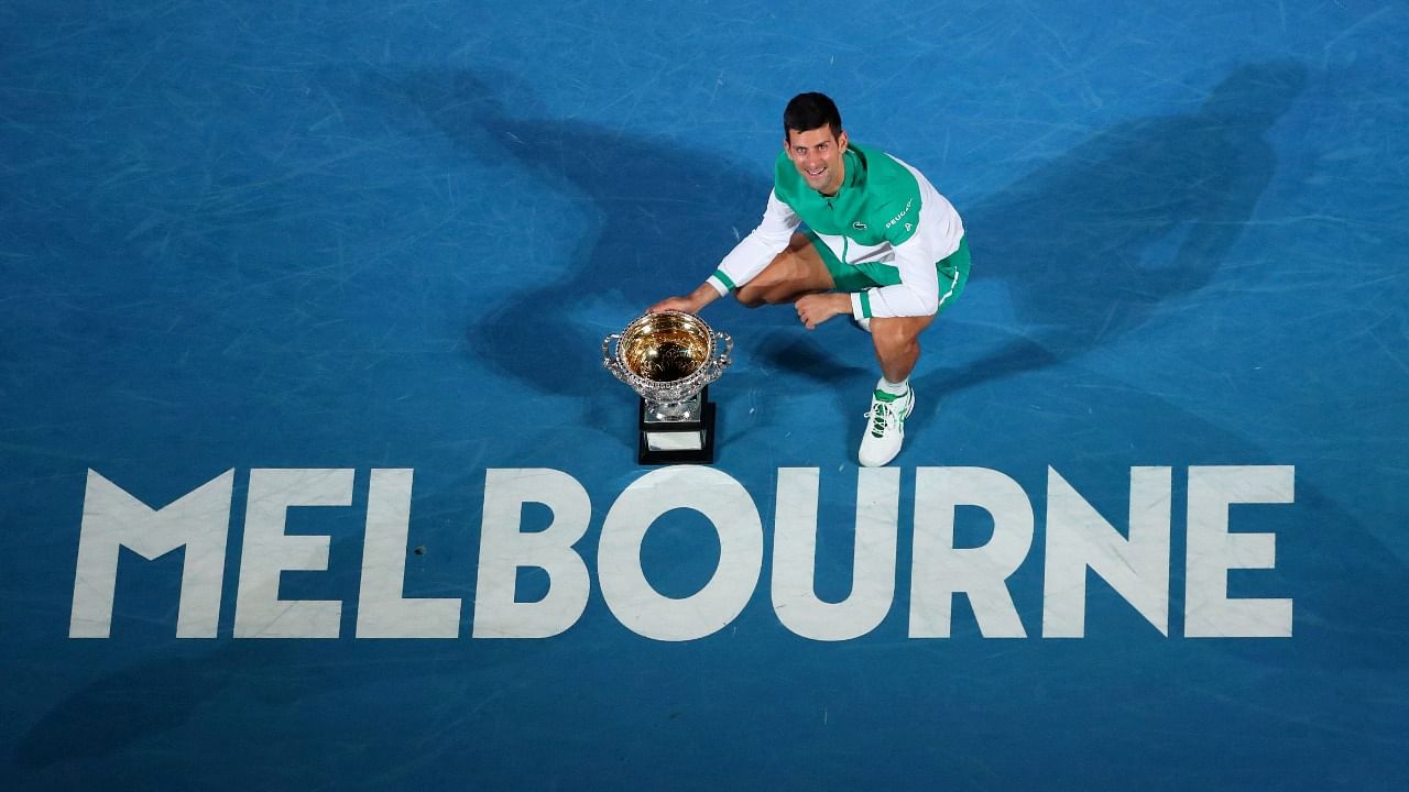 Serbia's Novak Djokovic celebrates with the trophy after winning his final match against Russia's Daniil Medvedev. Credit: Reuters File Photo