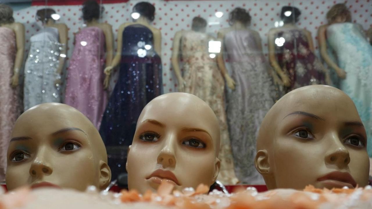 The heads of mannequins (foreground) are seen at a at a women's clothing store in Herat. Credit: AFP Photo