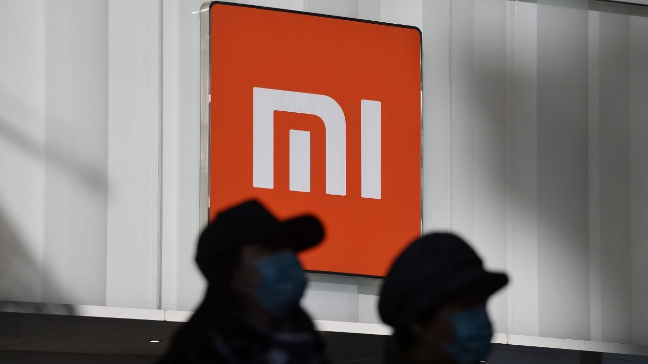 The MI brand mobile phones manufactured by the contract manufacturers are sold exclusively to Xiaomi India, in terms of the contract agreement. Credit: AFP File Photo