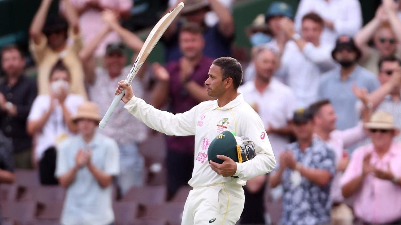 Usman Khawaja acknowledges the crowd as he walks back after his dismissal on day two of the fourth Ashes Test. Credit: AFP Photo