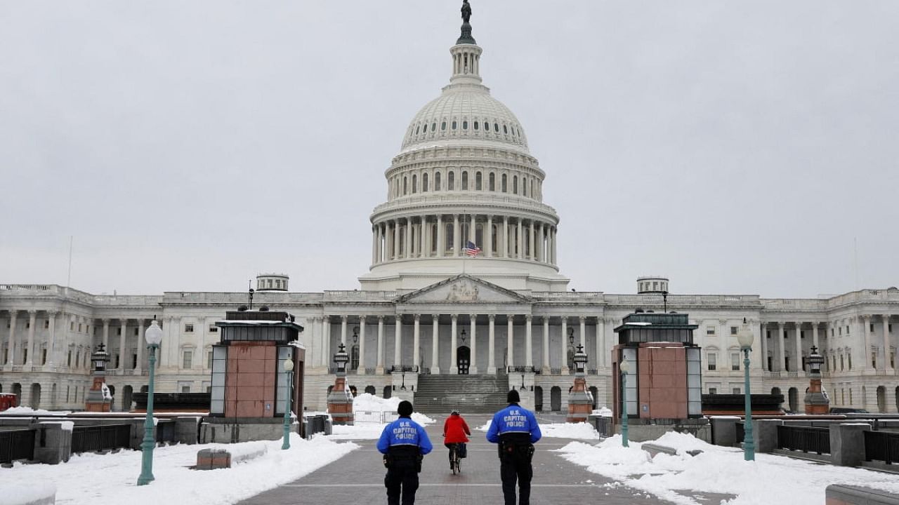 US Capitol Police Officers patrol the East Front Plaza on the eve of the first anniversary of the January 6, 2021 attack on the Capitol in Washington, US. Credit: Reuters Photo