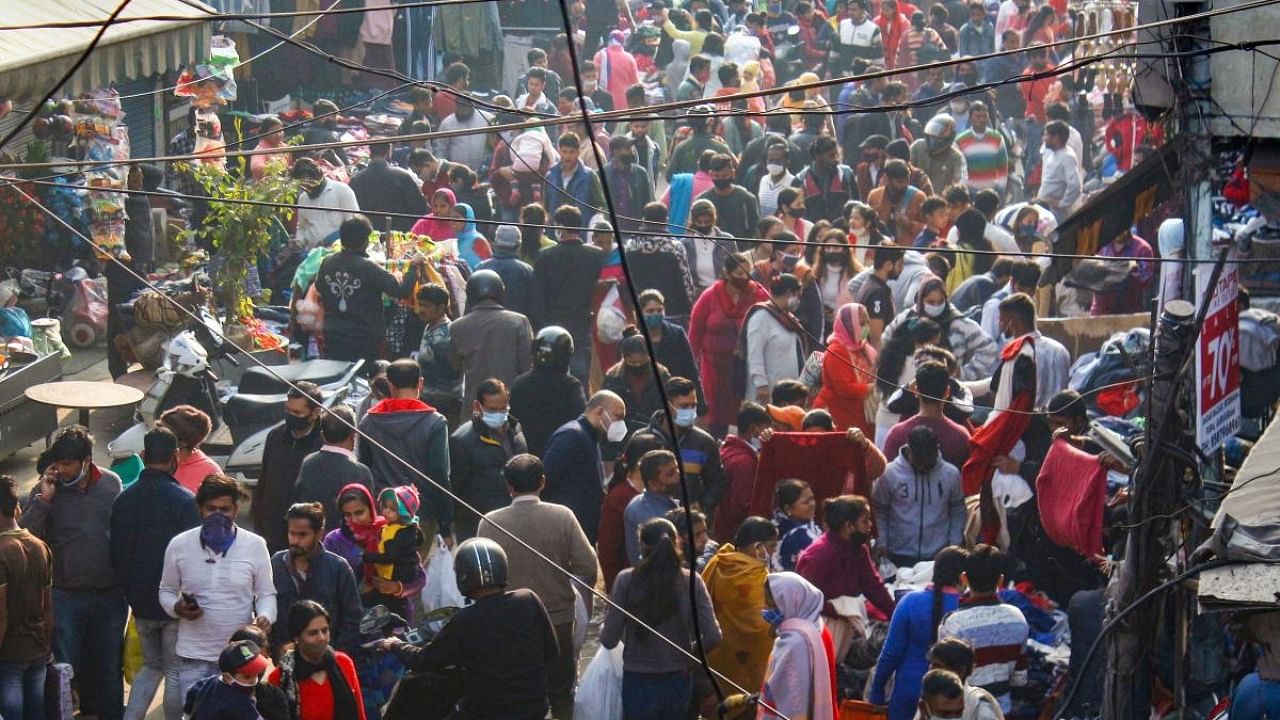 Crowded Sadar Bazar market amid rising cases of Omicron variant of Covid-19, in Gurugram. Credit: PTI Photo