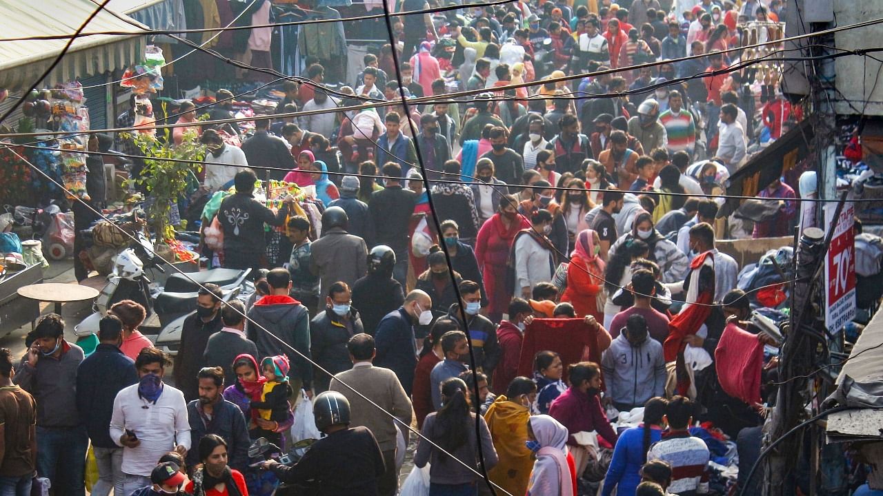  Crowded Sadar Bazar market amid rising cases of Omicron variant of Covid-19, in Gurugram. Credit: PTI Photo