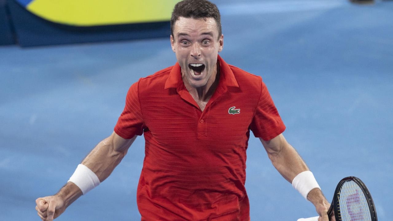 Roberto Bautista Agut of Spain reacts after defeating Poland's Hubert Hurkacz during their semifinal match at the ATP Cup tennis tournament in Sydney. Credit: AP Photo