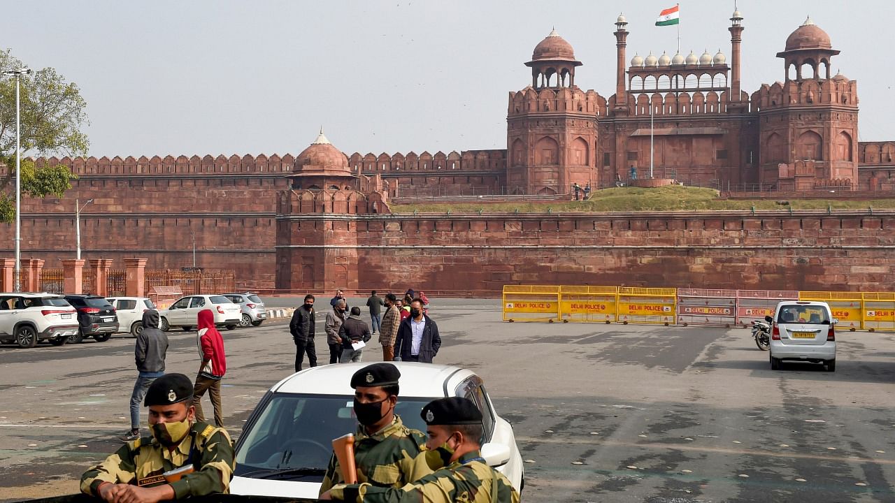 Security personnel stand guard outside the historic Red Fort, closed due to restrictions imposed amid a third wave of Covid-19. Credit: PTI Photo