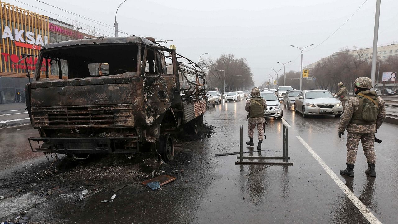 Troops take control of a street after widespread protests. Credit: Reuters Photo