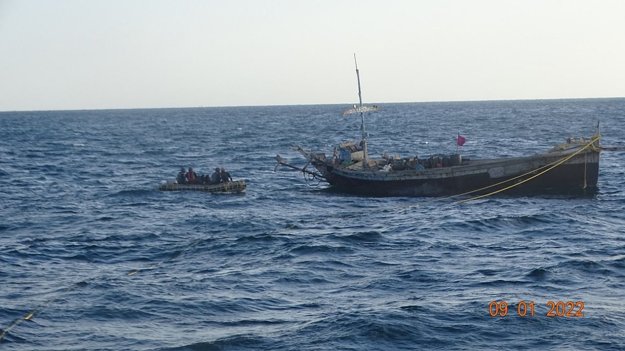 Crew members of Pakistani boat 'Yaseen' (R) being apprehended by the Indian Coast Guard off the coast of Gujarat. Credit: Twitter/@DefencePRO_Guj
