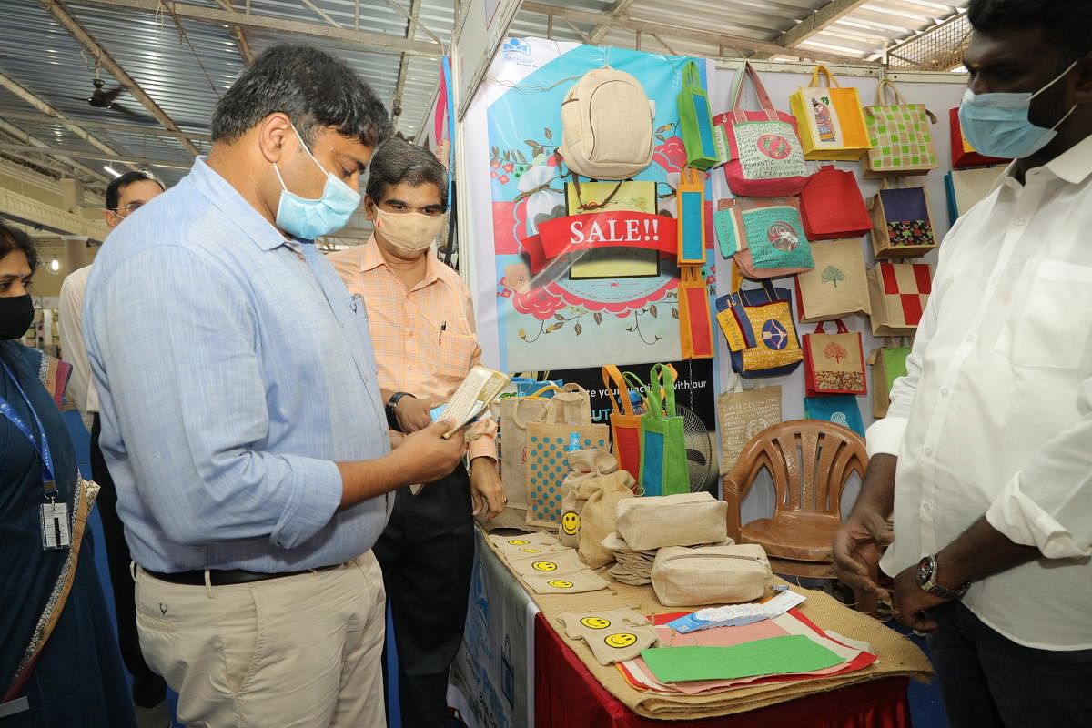 Deputy Commissioner Dr Rajendra K V looks at jute products during a jute fair at Woodlands Hotel in Mangaluru.