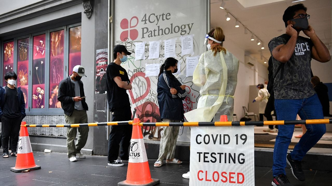 People queue at a walk-in coronavirus disease testing site in Melbourne. Credit: Reuters Photo